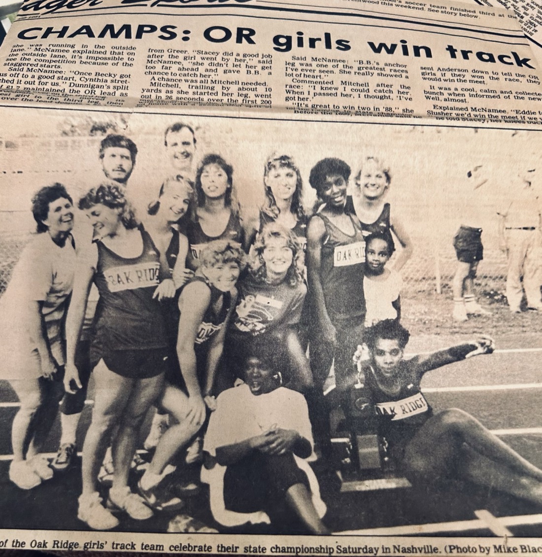 Newspaper clipping from The Oak Ridger headlined "CHAMPS: OR girls win track", with Sylvia Brinkman at far left among the 1988 Oak Ridge girls&rsquo; track team