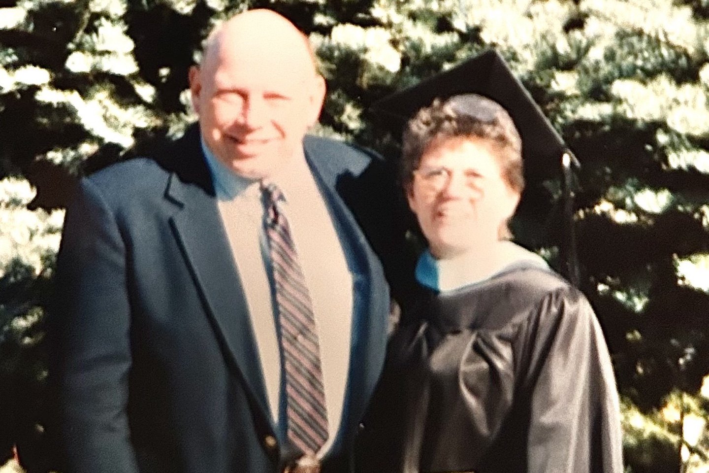 Sylvia Brinkman in cap and gown with Skip Brinkman